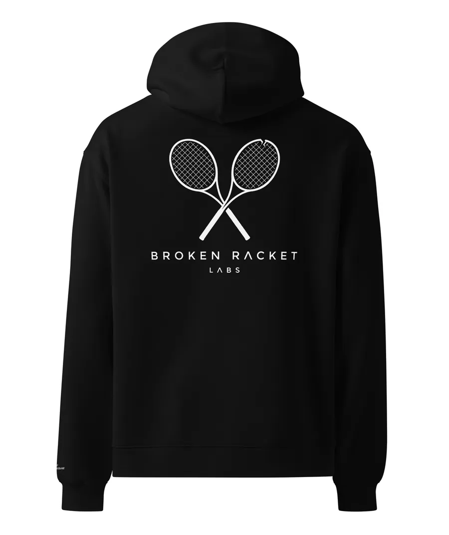 The Lab Coat in black, back view with the white Broken Racket Labs lockup